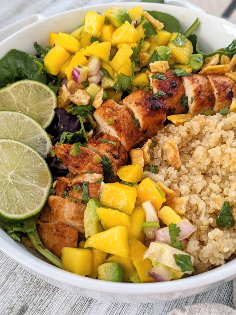 Closeup shot of the bowl of a chicken and mango taco bowl.