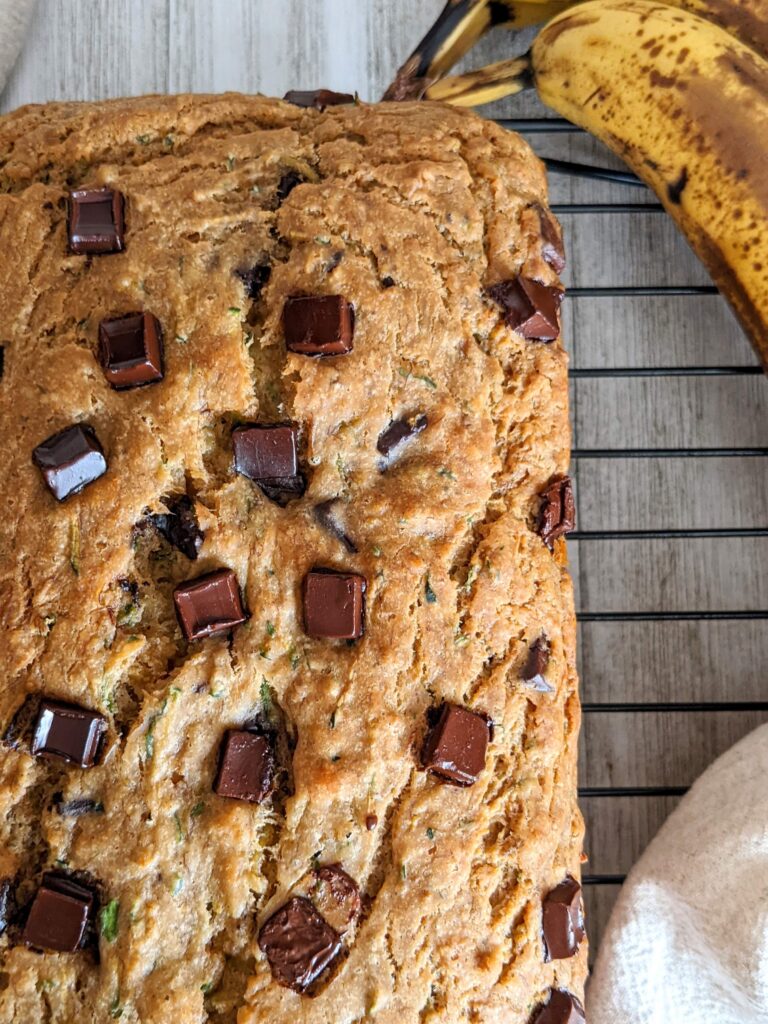 Closeup of the top of the finished and uncut loaf of banana bread.